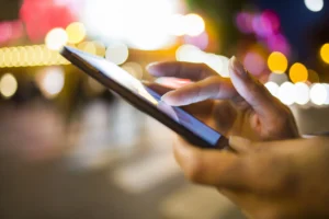 person using phone with apps and App Install Campaigns