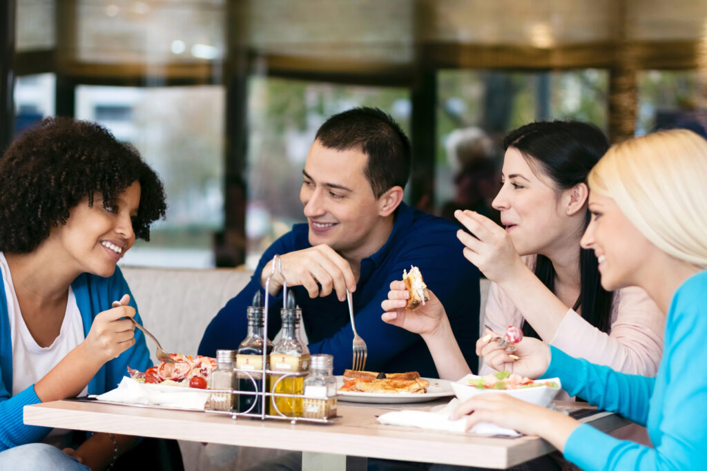people eating at restaurant that uses programmatic advertising software