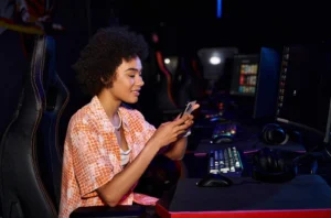 woman playing mobile game after seeing app install campaigns