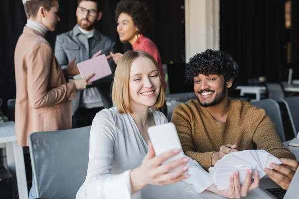 people with phone and ads using programmatic adTech