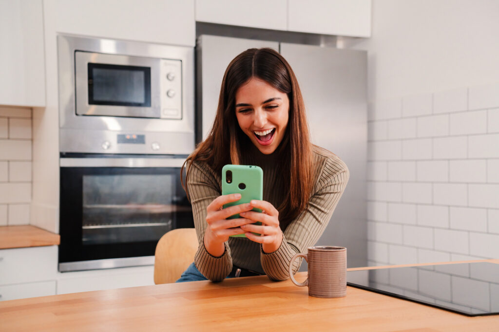 woman with phone apps that use programmatic ad tech