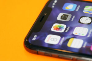 close-up of phone with apps and app install ads