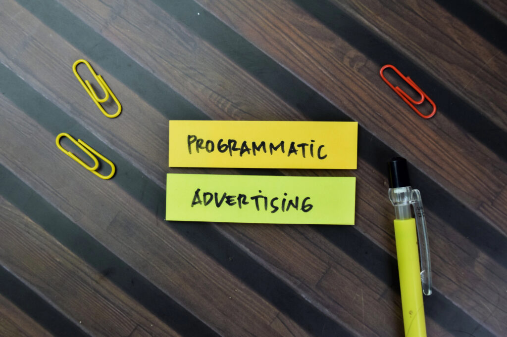 notes on a table say programmatic advertising