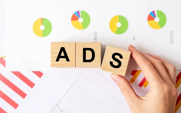 cubes spelling the word ads to illustrate automated ad buying