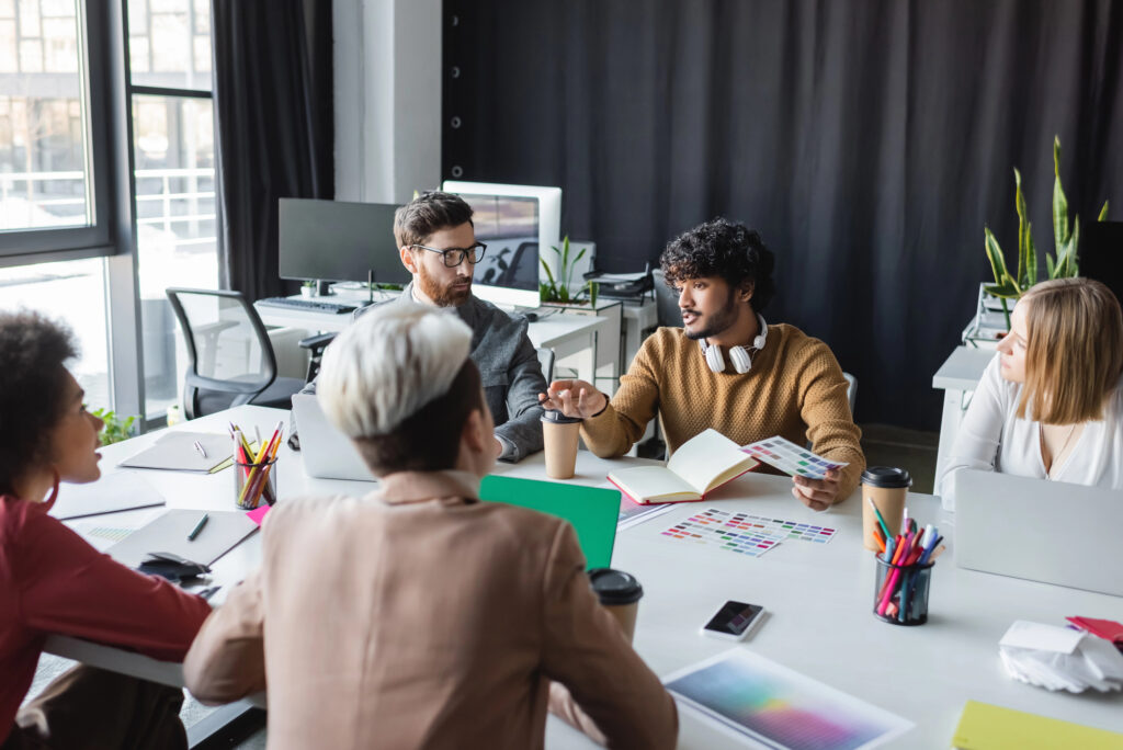 people holding meeting for mobile app advertising