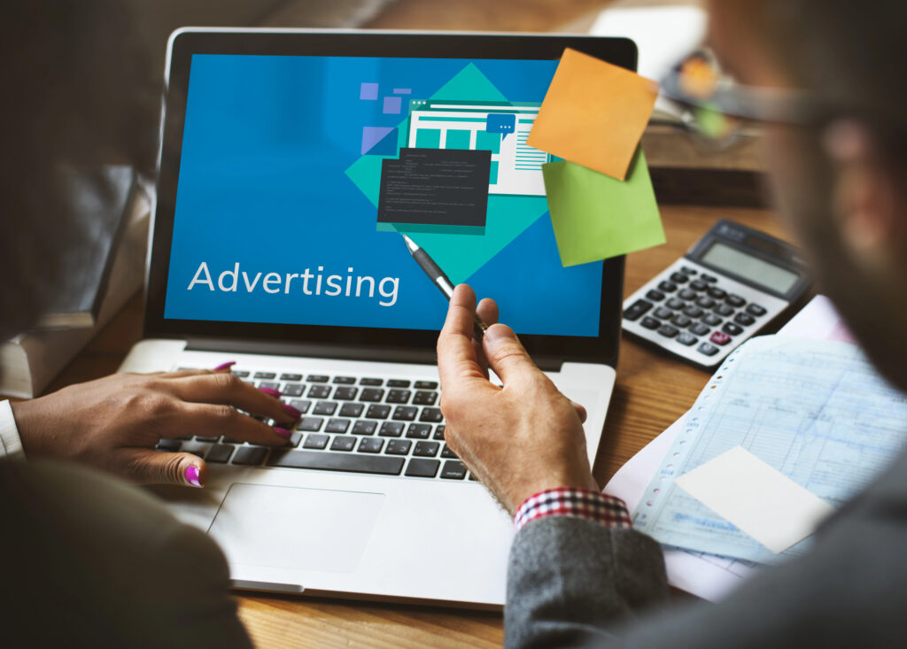computer with notes and programmatic advertising software